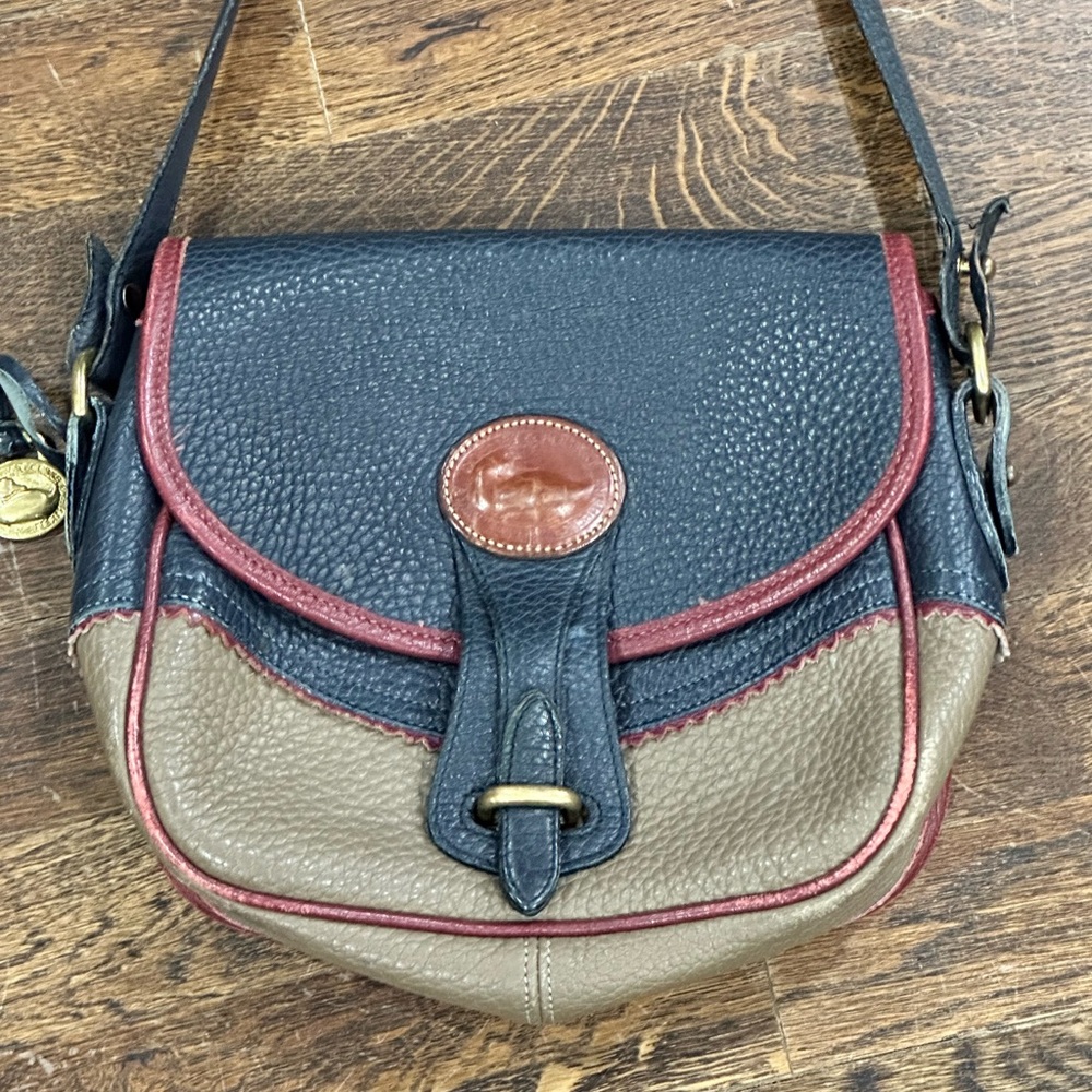 Vintage Dooney & Bourke Multi-Color Crossbody Bag with Flap Closure